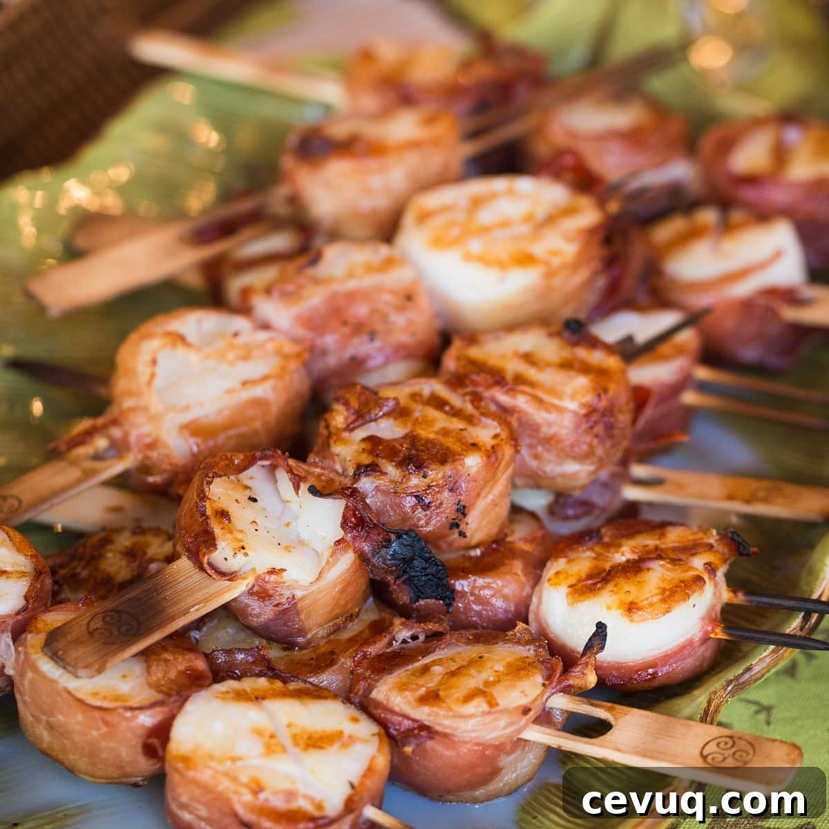 Grilled scallops wrapped with prosciutto and mango sauce.