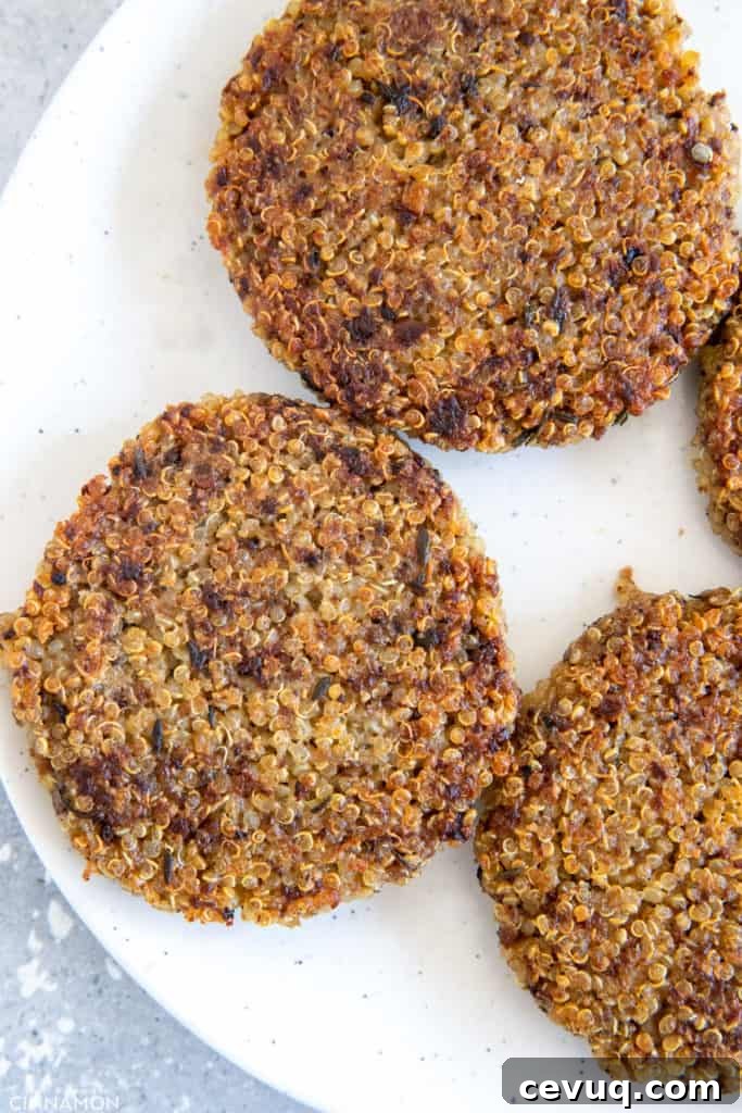 pan-fried glutenfree mushroom quinoa patties on a white plate 