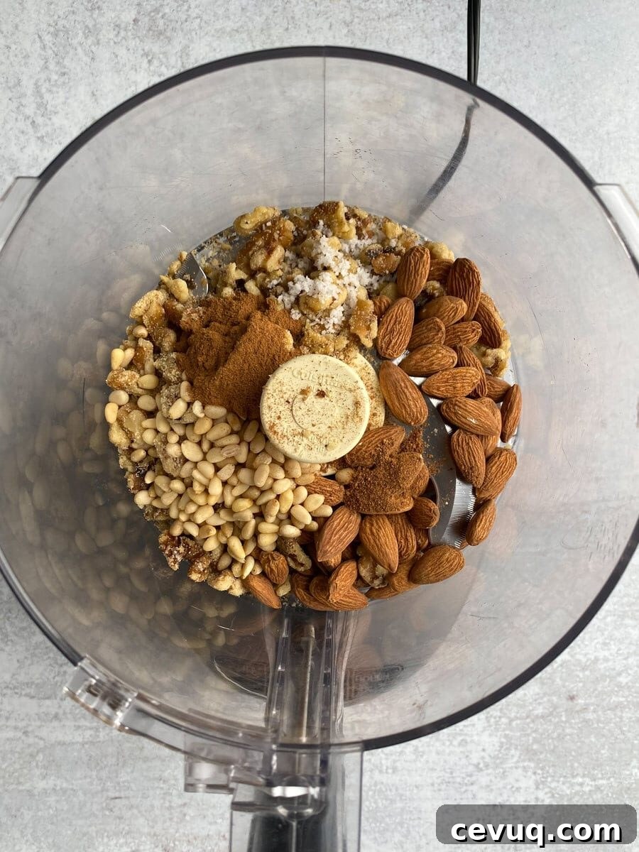 Grinding nut mixture and spices in mixer.