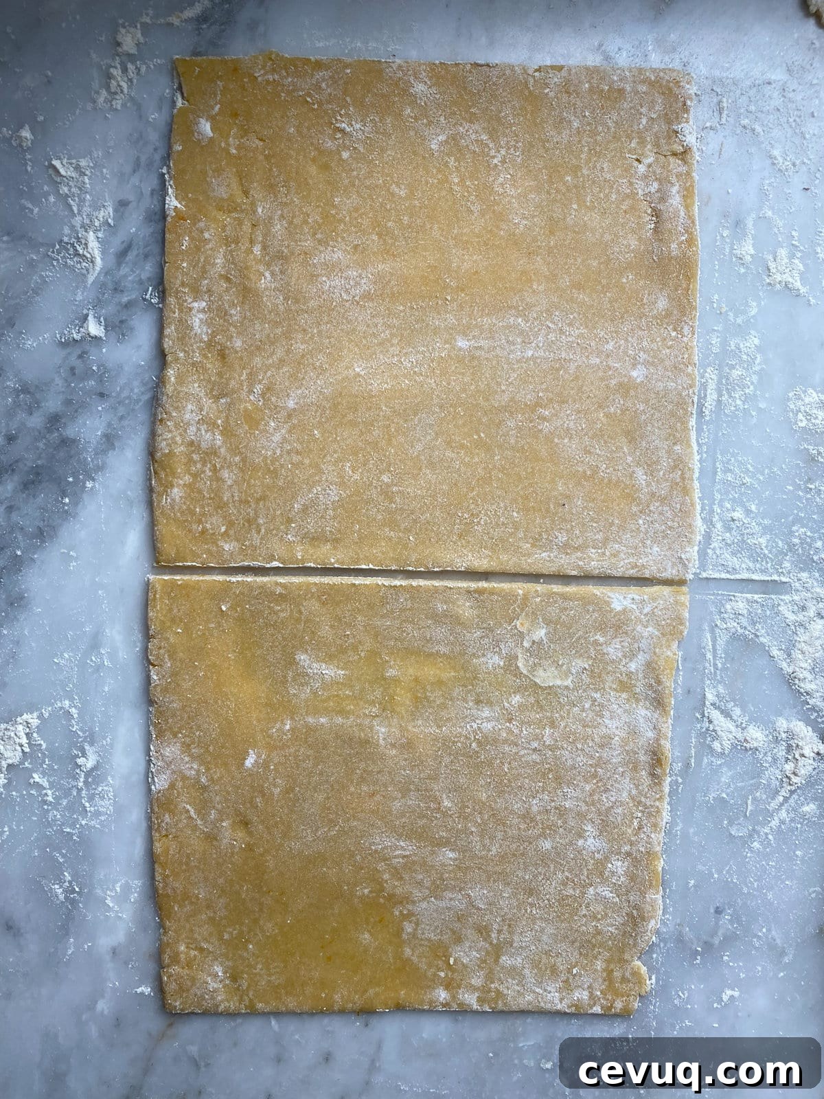 Dough rolled out and cut in half.