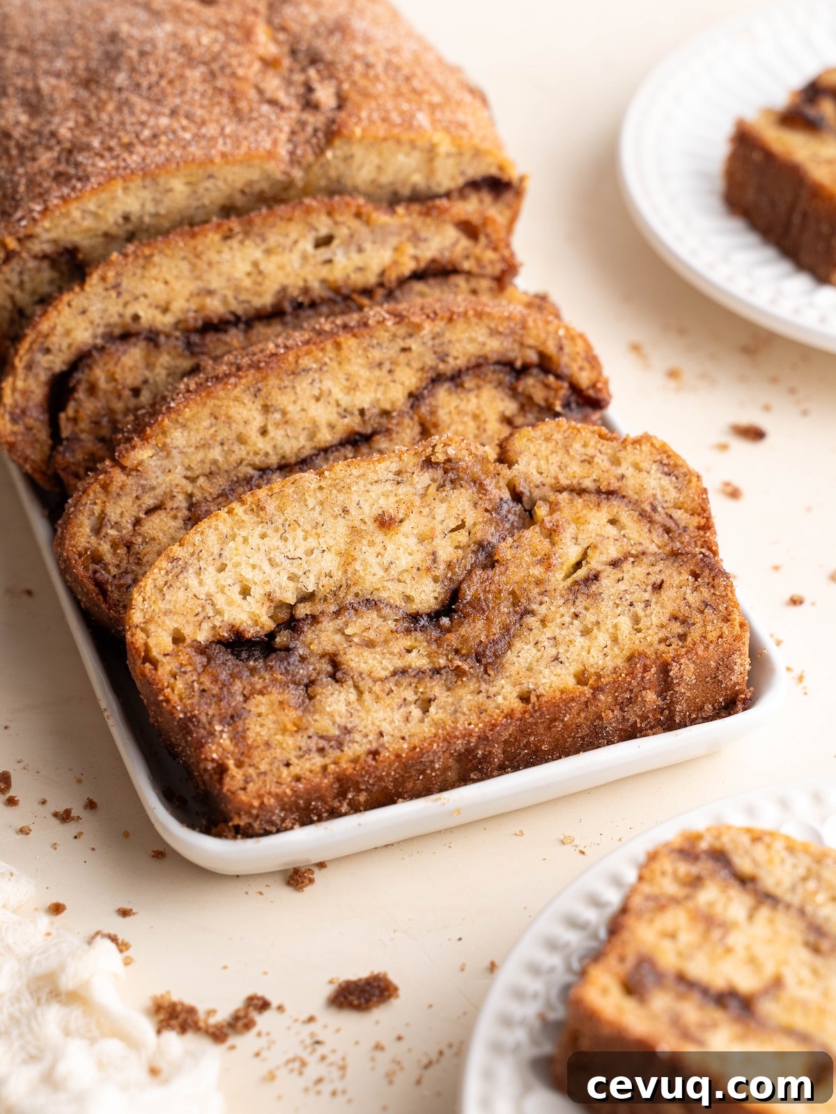 Cinnamon swirl banana bread sliced on plates