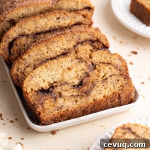 Cinnamon swirl banana bread sliced on plates