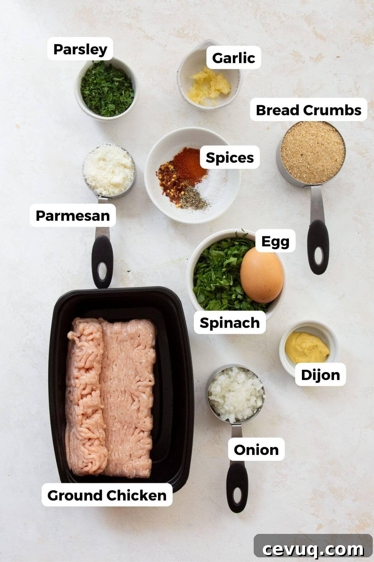 All ingredients for air fryer chicken meatballs displayed in small labeled bowls.
