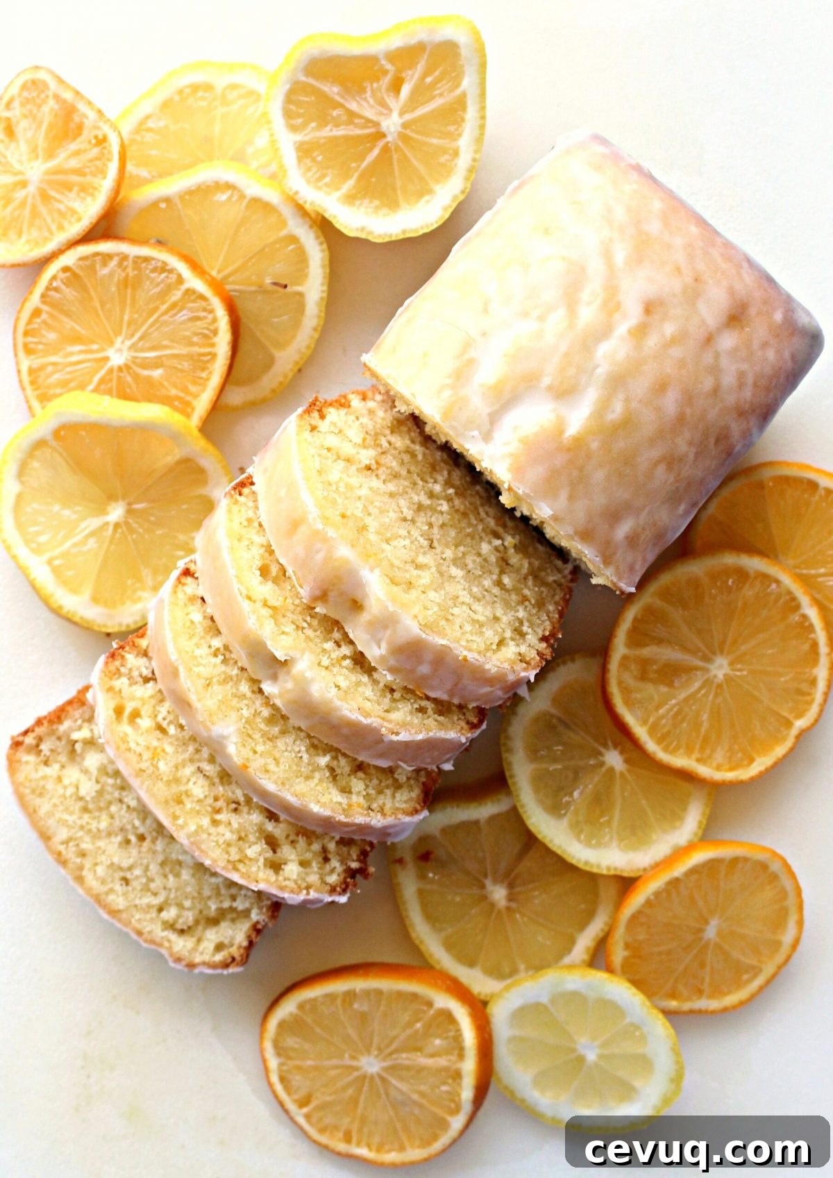 Iced Lemon Loaf sliced to show soft, dense interior.