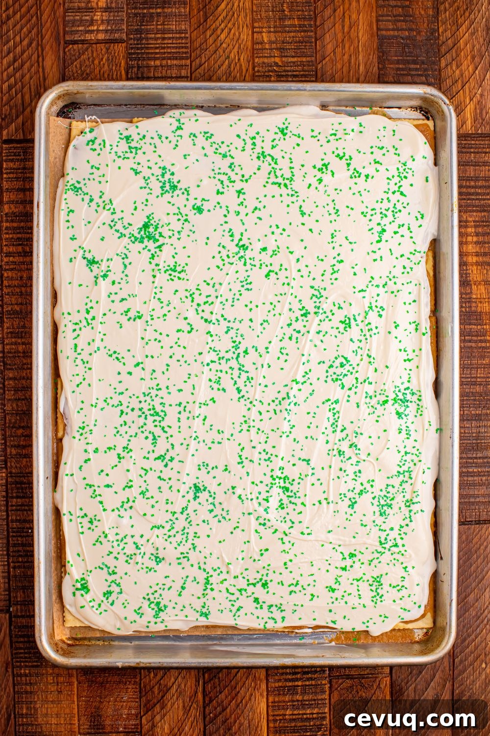 overhead view of Christmas Tree Crack in a sheet pan with green sprinkles on top