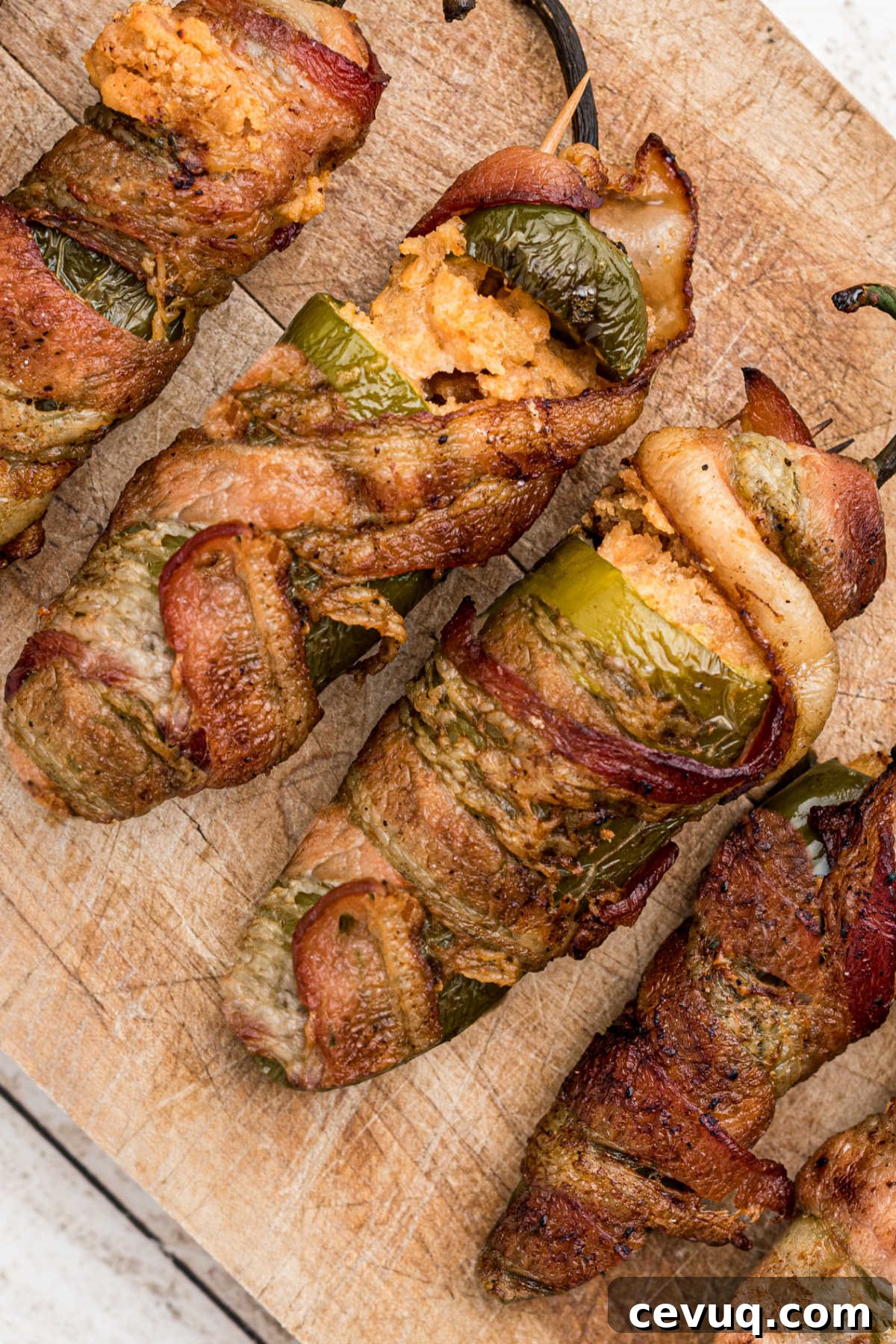 Stuffed jalapeno peppers, with cheese, and bacon wrapped around the outside.