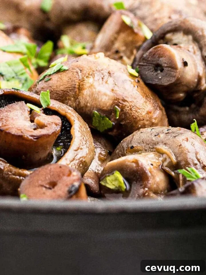 close up of some smoked mushrooms in a cast iron pot.